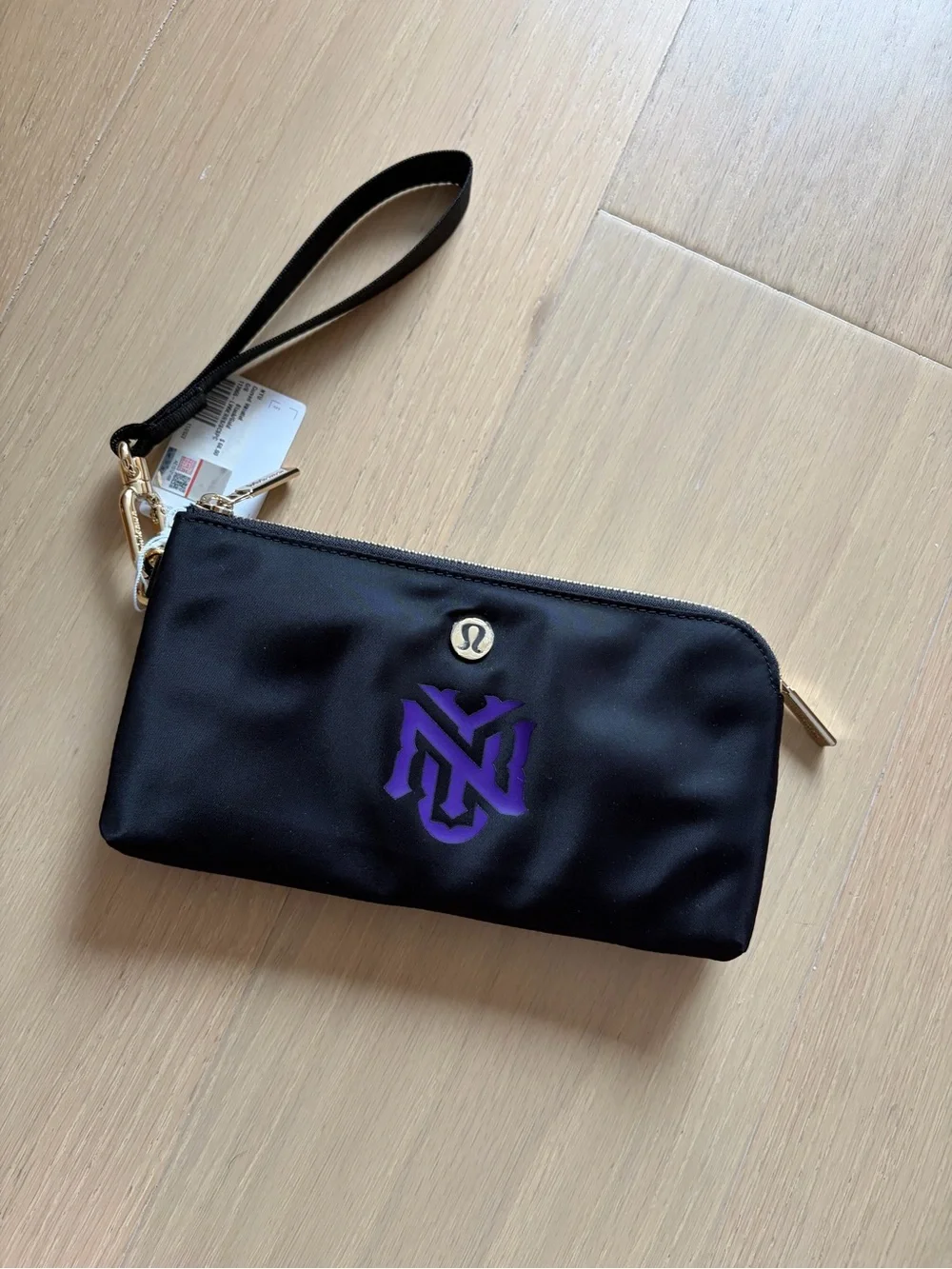 NWT Lululemon Black Wristlet Pouch with NYU logo